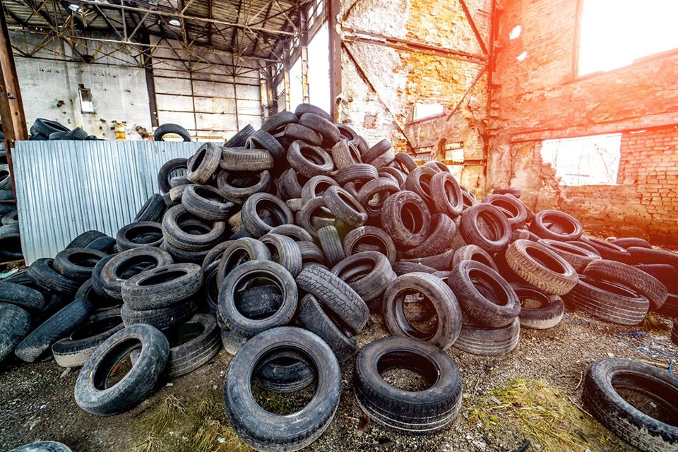 A pile of tyres in a disused warehouse