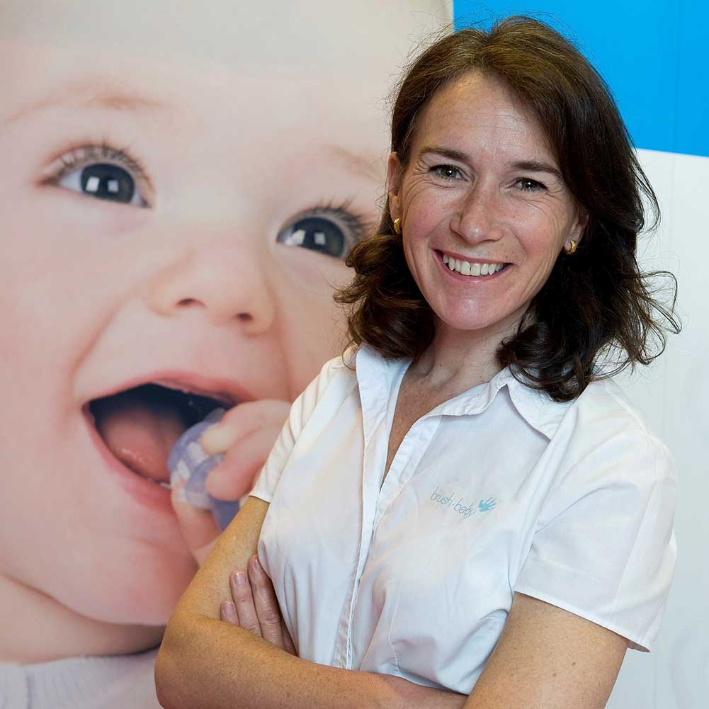 Owner of Brush Baby, Dominique Tillen stood beside one of her banners 