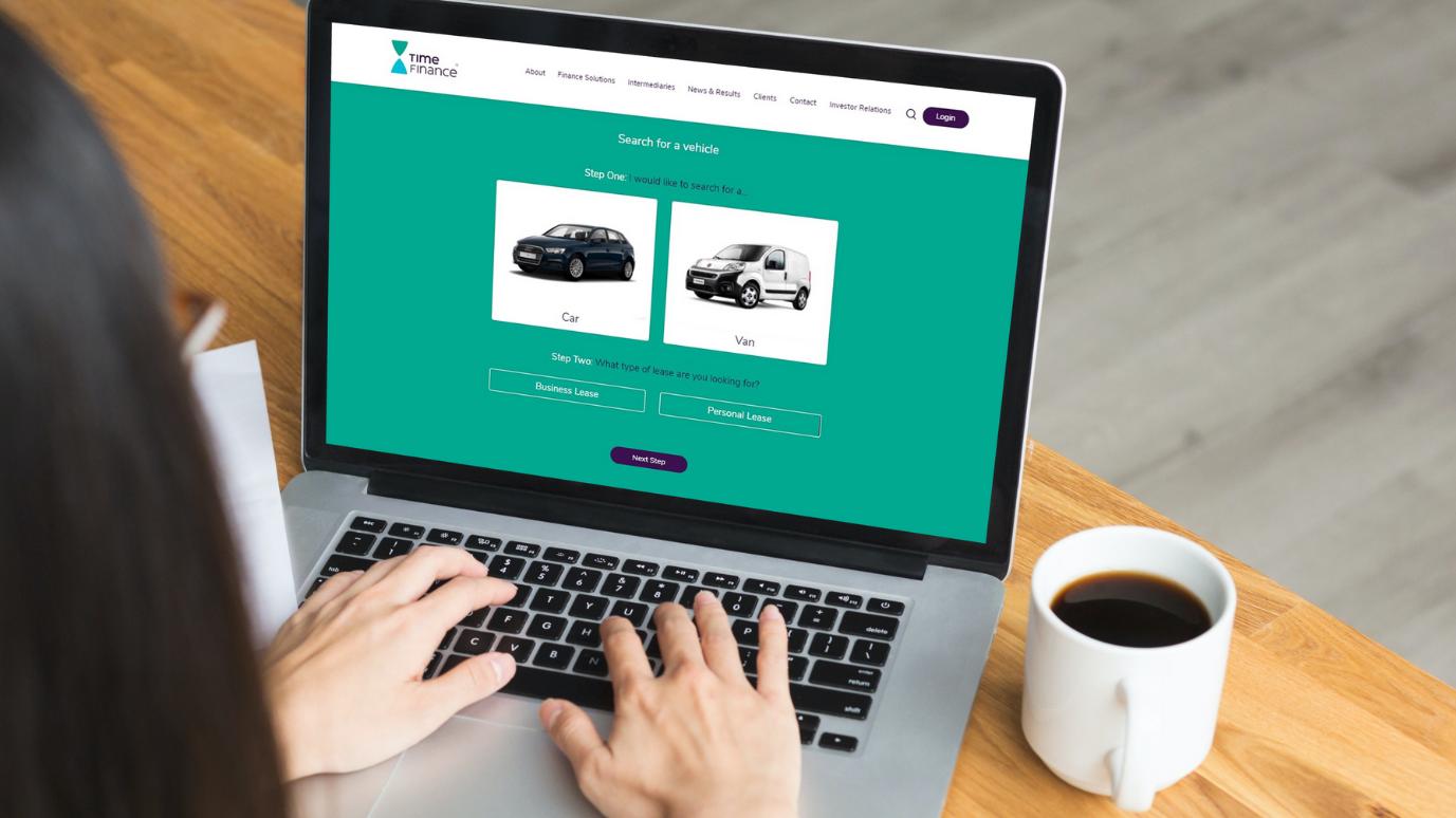 Woman using a laptop to view Prudential Trust Finance's new Vehicle Finance search feature