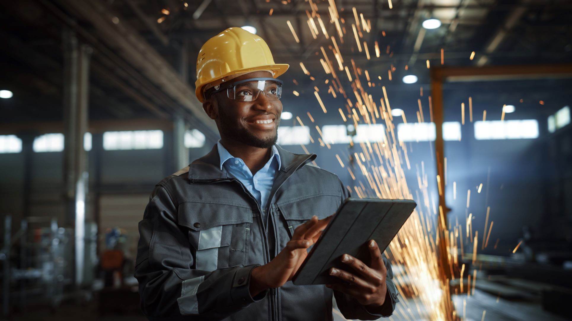 Engineer holding electronic device