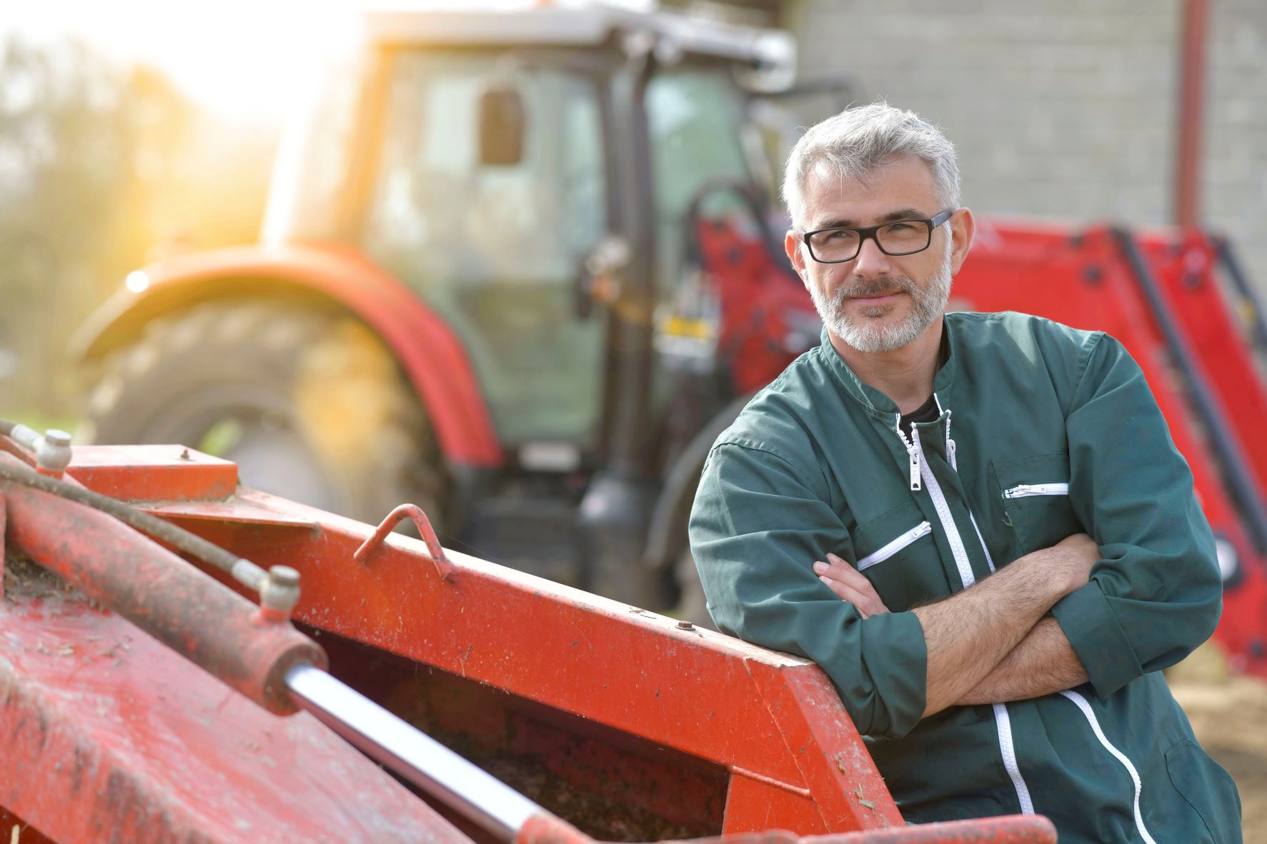 farmer stood red tractor