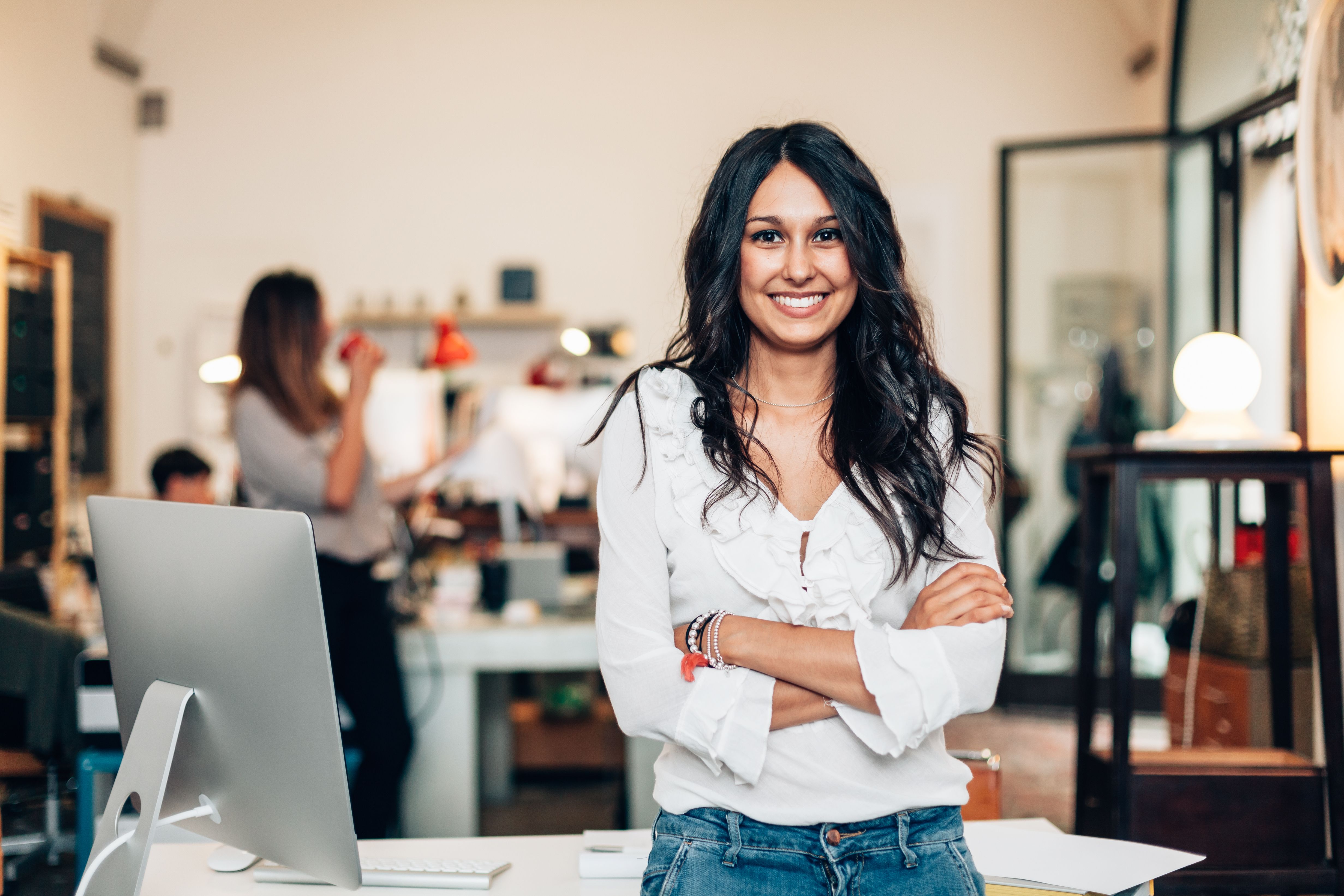 Woman standing by desk