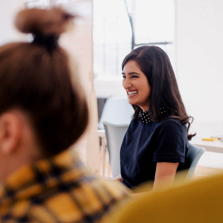 Business woman smiling in the background