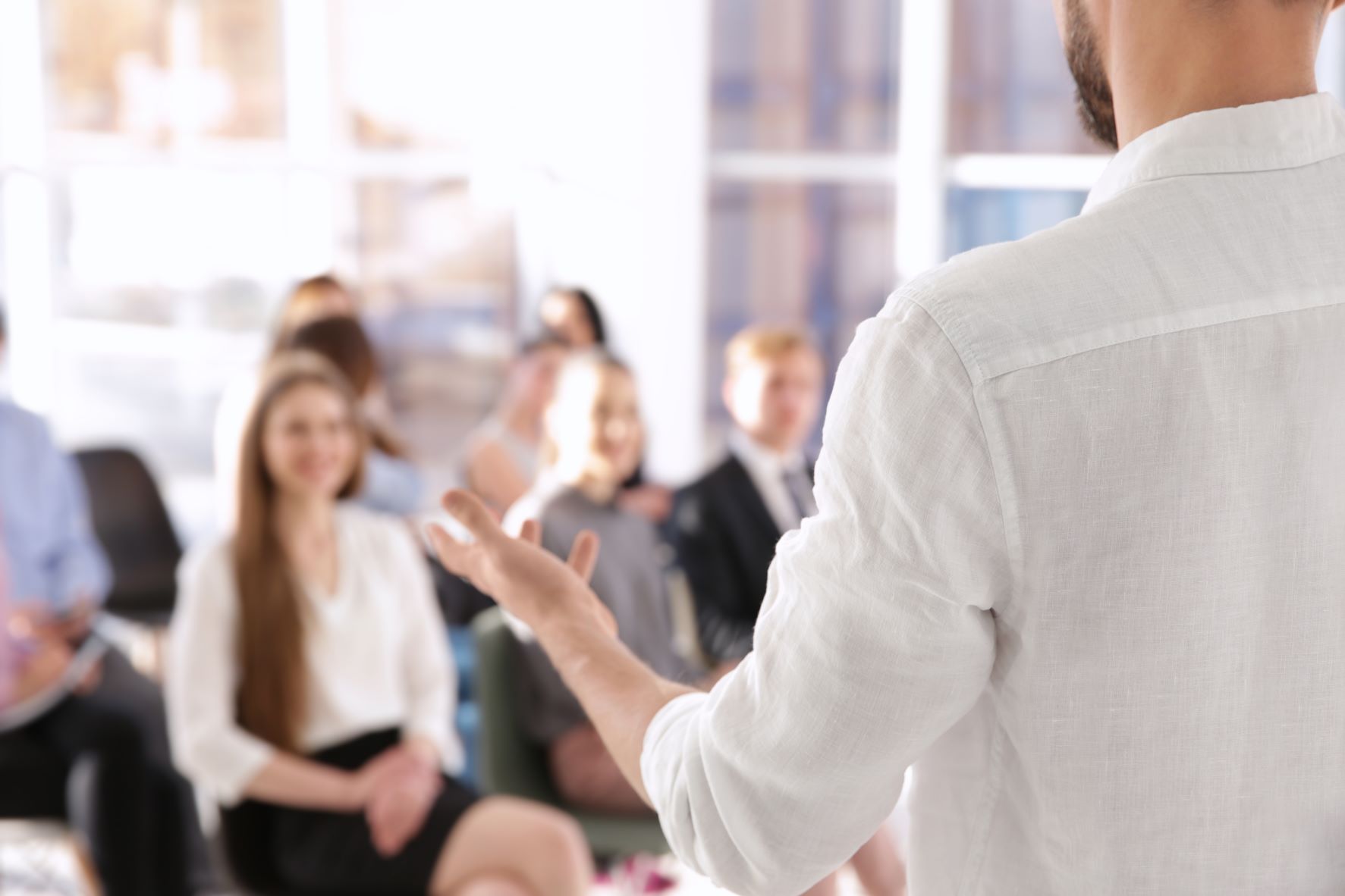 Man talking to colleagues